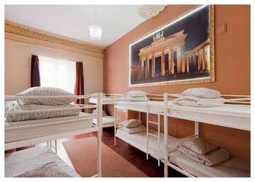 Фото номера Односпальная кровать в общем номере с 10 кроватями Хостелы One World Hostel г. Краков 7