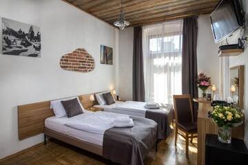 Фото номера Двухместный номер с 2 отдельными кроватями Апарт-отели Aparthotel Pergamin г. Краков 7