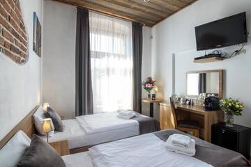 Фото номера Двухместный номер с 2 отдельными кроватями Апарт-отели Aparthotel Pergamin г. Краков 6