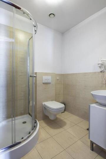 Фото номера Двухместный номер с 2 отдельными кроватями Апарт-отели Aparthotel Pergamin г. Краков 5