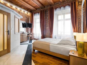Фото номера Улучшенный номер-студио Делюкс Апарт-отели Aparthotel Stare Miasto г. Краков 2