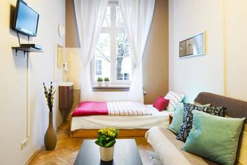 Фото номера Апартаменты с 3 спальнями Апартаменты Berry Apartments г. Краков 3
