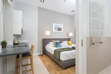 Фото номера Двухместный номер с 2 отдельными кроватями Апарт-отели Venetian House Market Square Aparthotel г. Краков 5