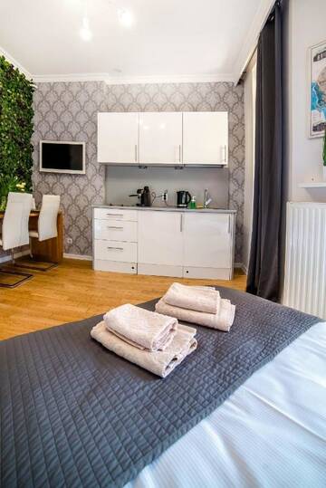 Фото номера Апартаменты-студио с балконом Апартаменты Cracovia Apartments г. Краков 8