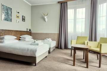 Фото номера Классический четырехместный номер с видом на город Апарт-отели Daniel Griffin Aparthotel by Artery Hotels г. Краков 9