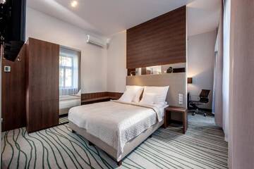 Фото номера Двухместный номер Делюкс с 1 кроватью Отель Plaza Boutique Hotel г. Краков 3