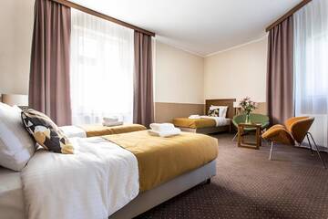 Фото номера Трехместный номер, вид на сад Апарт-отели Zulian Aparthotel by Artery Hotels г. Краков 3