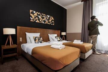 Фото номера Трехместный номер, вид на сад Апарт-отели Zulian Aparthotel by Artery Hotels г. Краков 11