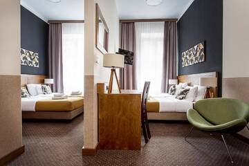 Фото номера Четырехместный номер с видом на город Апарт-отели Zulian Aparthotel by Artery Hotels г. Краков 13