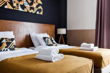 Фото номера Четырехместный номер с видом на город Апарт-отели Zulian Aparthotel by Artery Hotels г. Краков 11