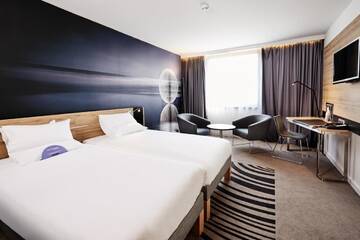 Фото номера Стандартный двухместный номер с 2 отдельными кроватями Отель Novotel Kraków Centrum г. Краков 5
